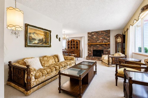 832 Canna Crescent Sw, Calgary, AB - Indoor Photo Showing Living Room With Fireplace