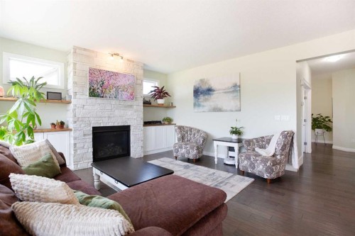 87 Baywater Rise Sw, Airdrie, AB - Indoor Photo Showing Living Room With Fireplace