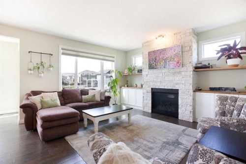 87 Baywater Rise Sw, Airdrie, AB - Indoor Photo Showing Living Room With Fireplace