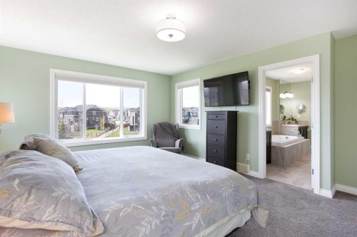 87 Baywater Rise Sw, Airdrie, AB - Indoor Photo Showing Bedroom