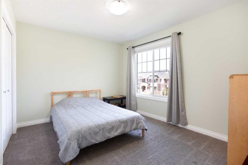 87 Baywater Rise Sw, Airdrie, AB - Indoor Photo Showing Bedroom