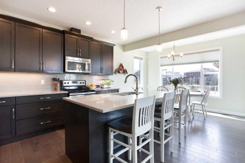 87 Baywater Rise Sw, Airdrie, AB - Indoor Photo Showing Kitchen With Upgraded Kitchen