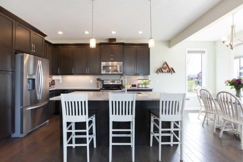 87 Baywater Rise Sw, Airdrie, AB - Indoor Photo Showing Kitchen With Upgraded Kitchen