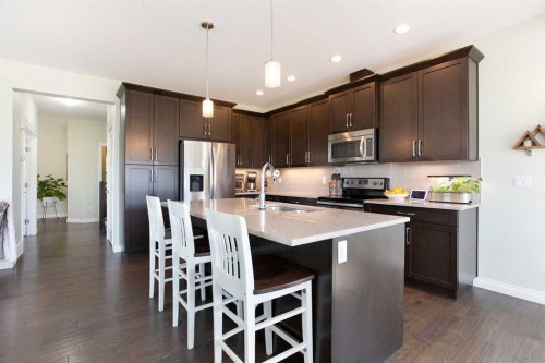 87 Baywater Rise Sw, Airdrie, AB - Indoor Photo Showing Kitchen With Upgraded Kitchen