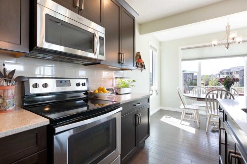 87 Baywater Rise Sw, Airdrie, AB - Indoor Photo Showing Kitchen With Upgraded Kitchen
