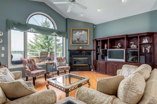 1001 East Chestermere Drive, Chestermere, AB - Indoor Photo Showing Living Room With Fireplace