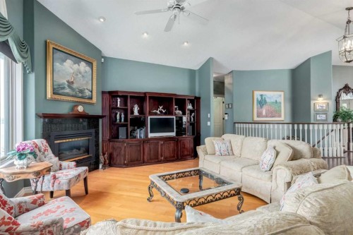 1001 East Chestermere Drive, Chestermere, AB - Indoor Photo Showing Living Room With Fireplace