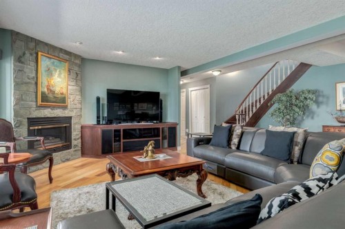 1001 East Chestermere Drive, Chestermere, AB - Indoor Photo Showing Living Room With Fireplace