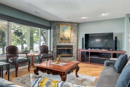 1001 East Chestermere Drive, Chestermere, AB - Indoor Photo Showing Living Room With Fireplace