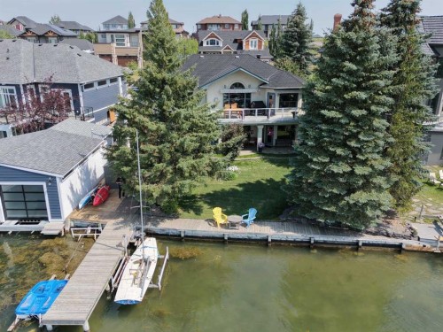 1001 East Chestermere Drive, Chestermere, AB - Outdoor With Body Of Water With Deck Patio Veranda