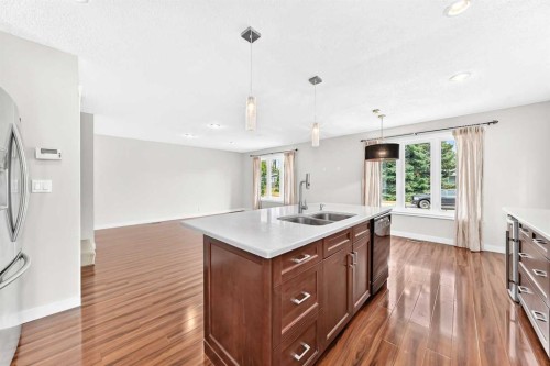 136 Midlawn Close Se, Calgary, AB - Indoor Photo Showing Kitchen With Double Sink