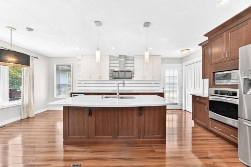 136 Midlawn Close Se, Calgary, AB - Indoor Photo Showing Kitchen With Double Sink With Upgraded Kitchen