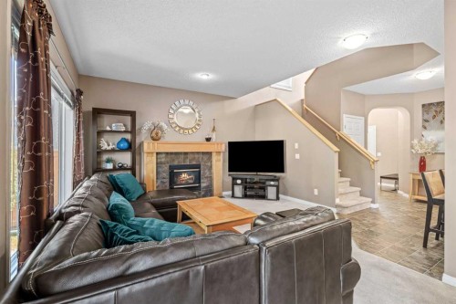 52 Copperfield Close Se, Calgary, AB - Indoor Photo Showing Other Room With Fireplace