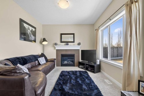 216 Ranch Downs, Strathmore, AB - Indoor Photo Showing Living Room With Fireplace