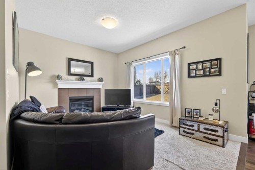 216 Ranch Downs, Strathmore, AB - Indoor Photo Showing Living Room With Fireplace