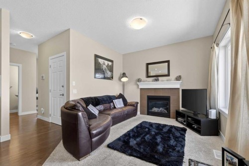 216 Ranch Downs, Strathmore, AB - Indoor Photo Showing Living Room With Fireplace