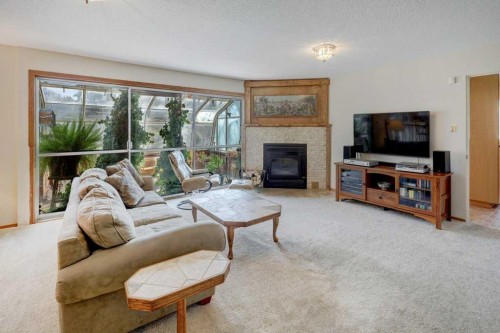 223 Willow Ridge Place Se, Calgary, AB - Indoor Photo Showing Living Room With Fireplace