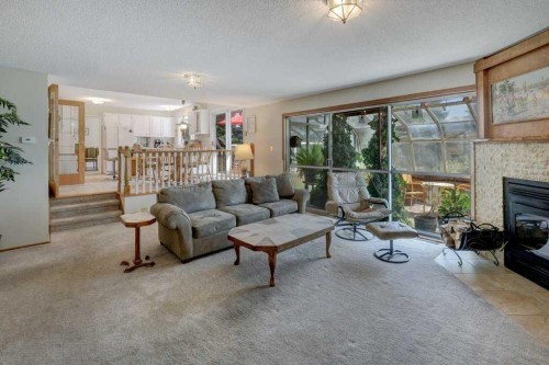 223 Willow Ridge Place Se, Calgary, AB - Indoor Photo Showing Living Room With Fireplace