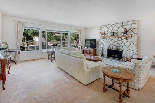 223 Willow Ridge Place Se, Calgary, AB - Indoor Photo Showing Living Room With Fireplace