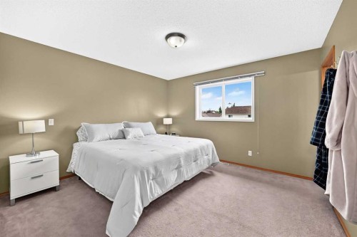 27 Erin Meadow Crescent Se, Calgary, AB - Indoor Photo Showing Bedroom