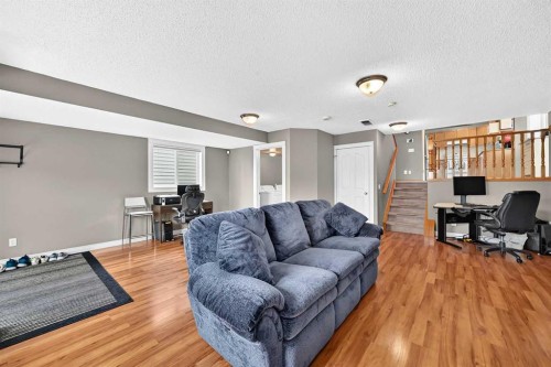 27 Erin Meadow Crescent Se, Calgary, AB - Indoor Photo Showing Living Room