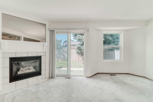 15 Harvest Glen Heights Ne, Calgary, AB - Indoor Photo Showing Living Room With Fireplace