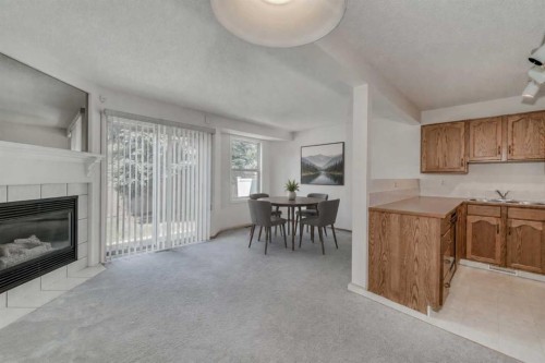 15 Harvest Glen Heights Ne, Calgary, AB - Indoor With Fireplace