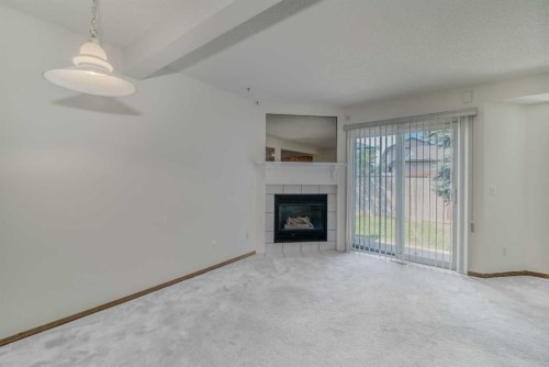 15 Harvest Glen Heights Ne, Calgary, AB - Indoor Photo Showing Living Room With Fireplace
