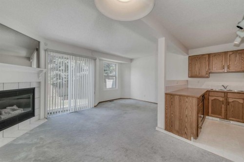 15 Harvest Glen Heights Ne, Calgary, AB - Indoor With Fireplace