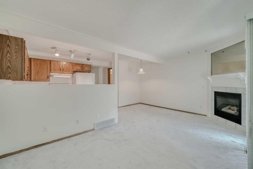 15 Harvest Glen Heights Ne, Calgary, AB - Indoor With Fireplace