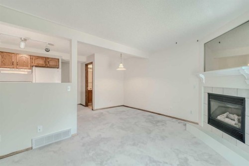 15 Harvest Glen Heights Ne, Calgary, AB - Indoor With Fireplace