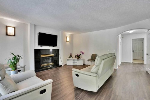 132 Evergreen Close Sw, Calgary, AB - Indoor Photo Showing Living Room With Fireplace