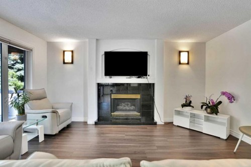 132 Evergreen Close Sw, Calgary, AB - Indoor Photo Showing Living Room With Fireplace