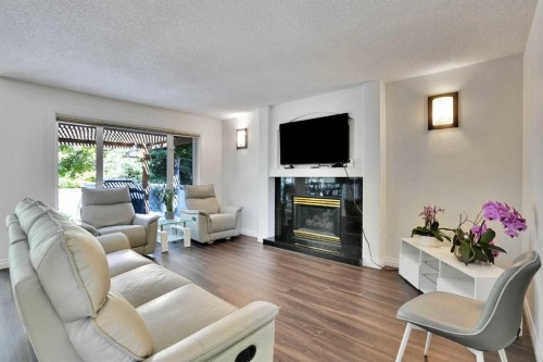 132 Evergreen Close Sw, Calgary, AB - Indoor Photo Showing Living Room With Fireplace