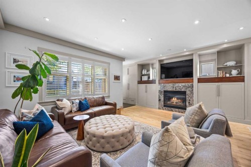 211 32 Avenue Nw, Calgary, AB - Indoor Photo Showing Living Room With Fireplace