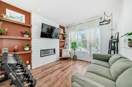 43 Masters Square Se, Calgary, AB - Indoor Photo Showing Living Room With Fireplace
