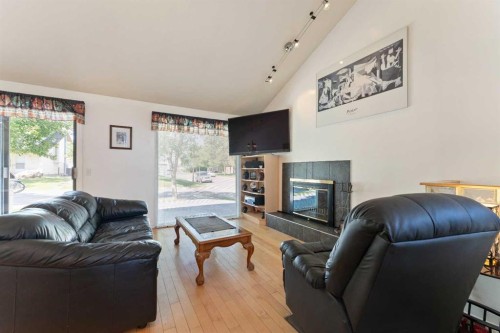 79 Templegreen Place Ne, Calgary, AB - Indoor Photo Showing Living Room With Fireplace
