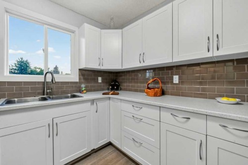 3046 32A Avenue Se, Calgary, AB - Indoor Photo Showing Kitchen With Double Sink