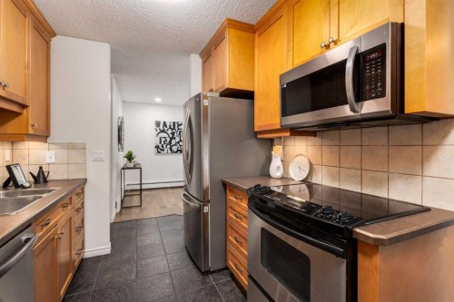 3-906 4 Avenue Nw, Calgary, AB - Indoor Photo Showing Kitchen With Stainless Steel Kitchen With Double Sink