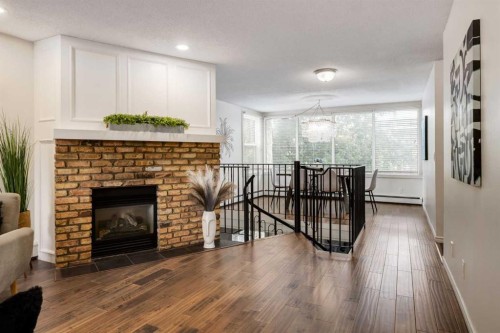 3-906 4 Avenue Nw, Calgary, AB - Indoor With Fireplace