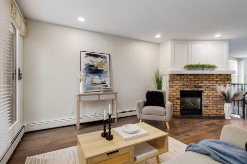 3-906 4 Avenue Nw, Calgary, AB - Indoor Photo Showing Living Room With Fireplace