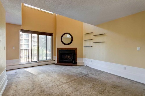 20-821 3 Avenue Sw, Calgary, AB - Indoor Photo Showing Living Room With Fireplace