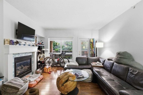 108-114 15 Avenue Sw, Calgary, AB - Indoor Photo Showing Living Room With Fireplace
