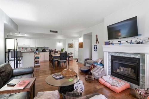 108-114 15 Avenue Sw, Calgary, AB - Indoor Photo Showing Living Room With Fireplace