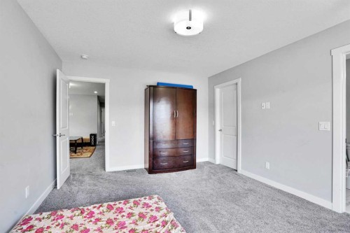50 Saddlestone Place Ne, Calgary, AB - Indoor Photo Showing Bedroom