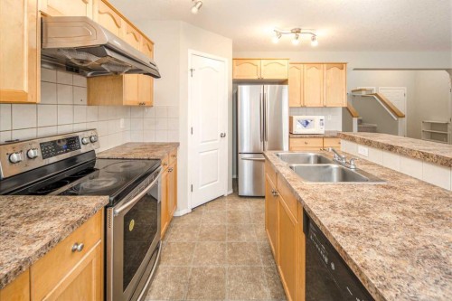 96 Panamount Manor Nw, Calgary, AB - Indoor Photo Showing Kitchen With Stainless Steel Kitchen With Double Sink