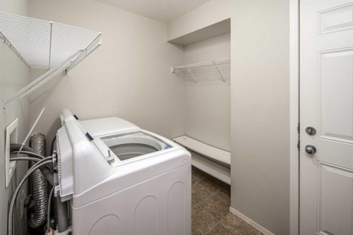 96 Panamount Manor Nw, Calgary, AB - Indoor Photo Showing Laundry Room