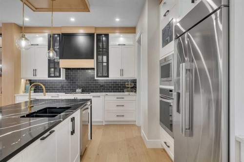 2012 Waterbury Road, Chestermere, AB - Indoor Photo Showing Kitchen With Double Sink With Upgraded Kitchen