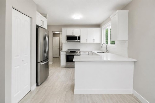115 Abingdon Crescent Ne, Calgary, AB - Indoor Photo Showing Kitchen With Stainless Steel Kitchen