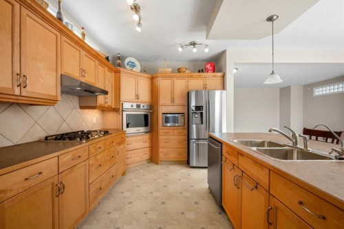 31 Elgin Green Se, Calgary, AB - Indoor Photo Showing Kitchen With Stainless Steel Kitchen With Double Sink